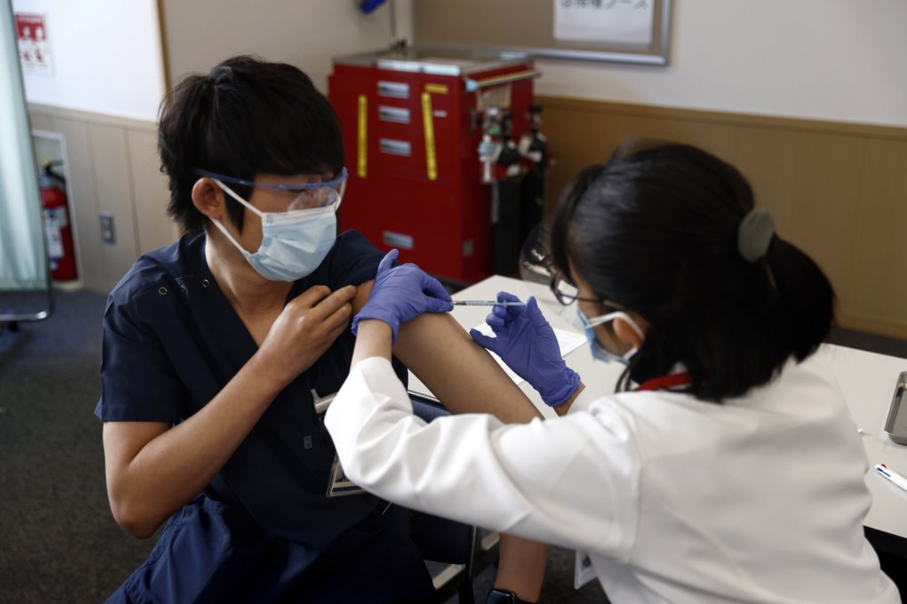 Japan starts COVID-19 vaccinations with eye on Olympics